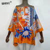 Orange and blue patterned batwing abaya top displayed on a mannequin