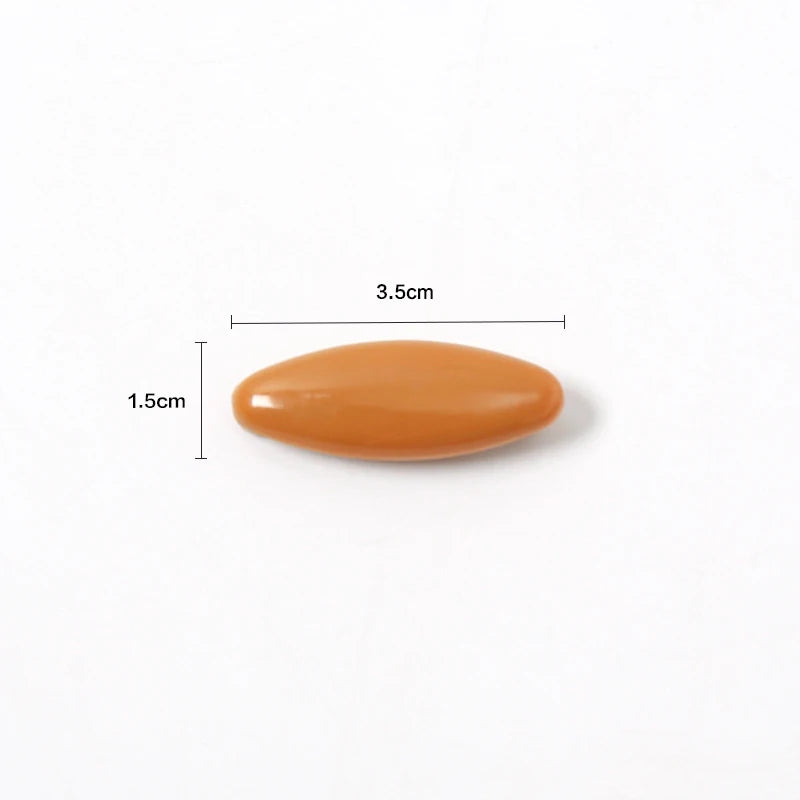 Un pin o clip de hijab de moda, ovalado y de color naranja claro.