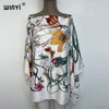 White batwing abaya top featuring a floral and vine pattern with shades of green, orange, and pink.