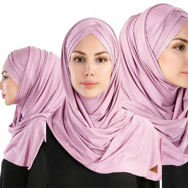 A woman wearing a soft pink cotton jersey hijab shawl