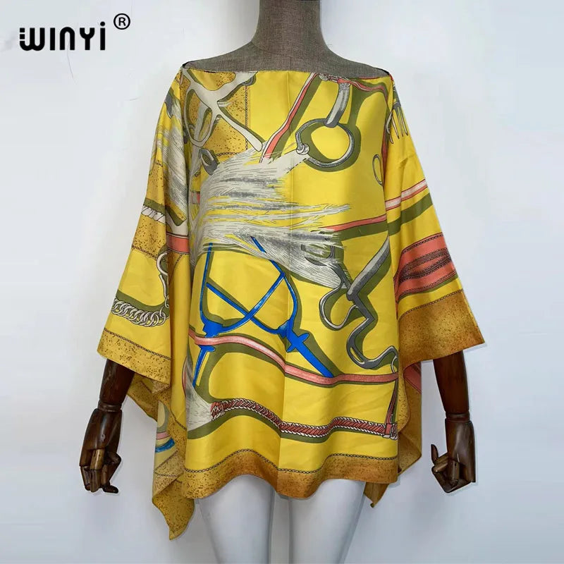 A yellow bohemian summer batwing abaya top displayed on a mannequin.