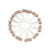 A circular arrangement of twelve silver-toned pearl brooch headscarf pins.