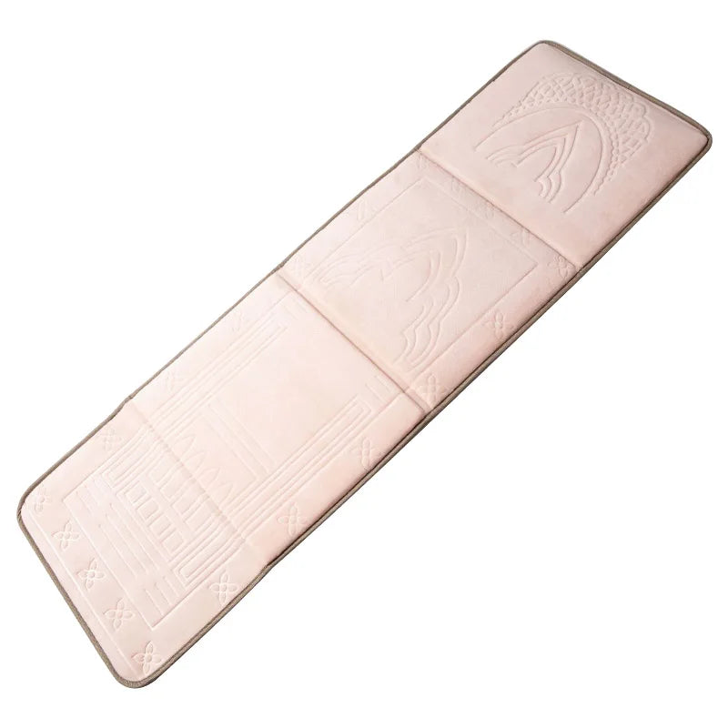 A beige foldable Islamic prayer rug shown from above.