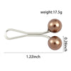 Broche para pañuelo anti-resbalante de perla plateada con 3.1 cm de largo y cabeza de perla de 0.7 cm.