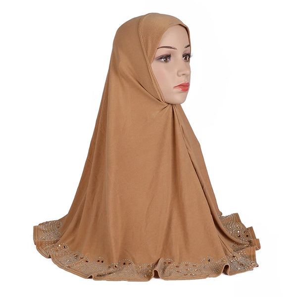 A model wearing an elegant brown diamond embellished Muslim hijab scarf.