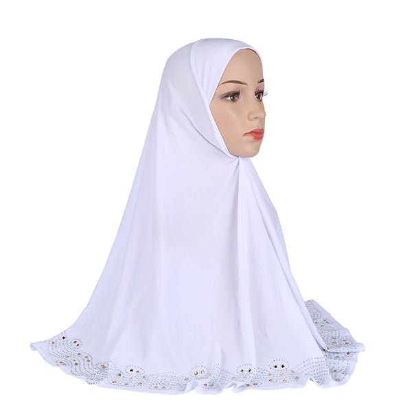 A white elegant diamond embellished Muslim hijab scarf worn by a model.