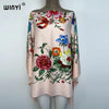 A light pink bohemian summer batwing abaya top featuring a colorful floral print.