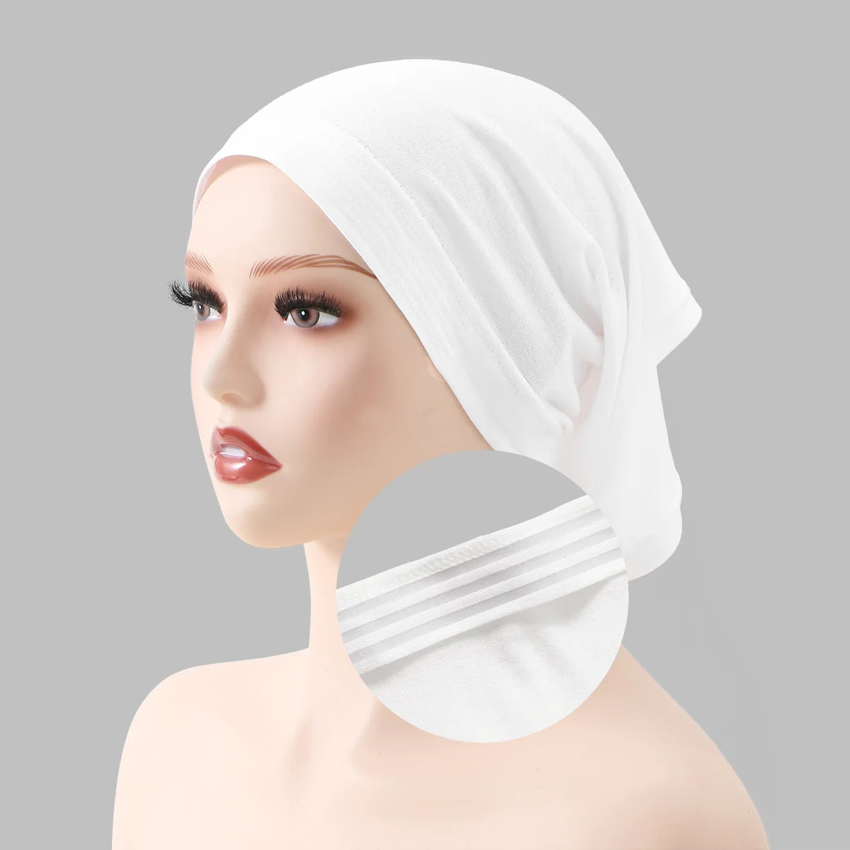 A mannequin head wearing a white adjustable elastic headband hijab cap for women.