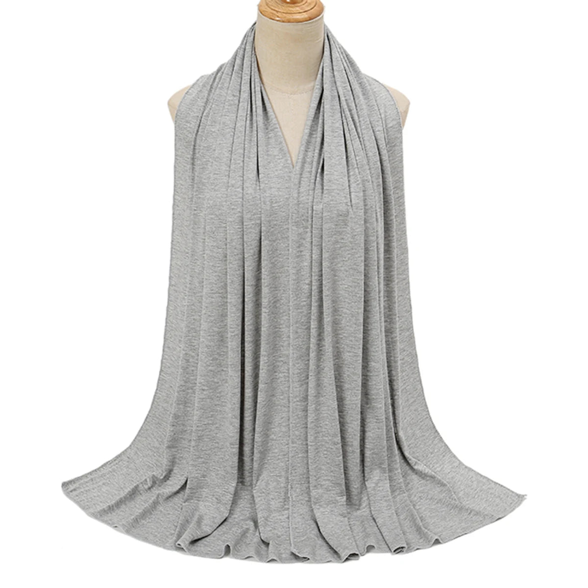 A gray soft modal jersey hijab scarf draped around a mannequin's neck.