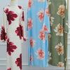 A long, light blue kaftan dress with a floral print displayed on a mannequin.