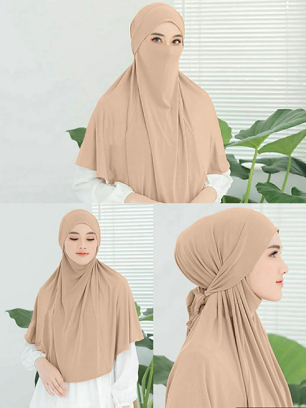 A woman wearing a beige instant turban hijab, shown in full view and close-up.