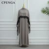 Vestido abaya largo color topo con detalles de encaje negro en mangas y escote.