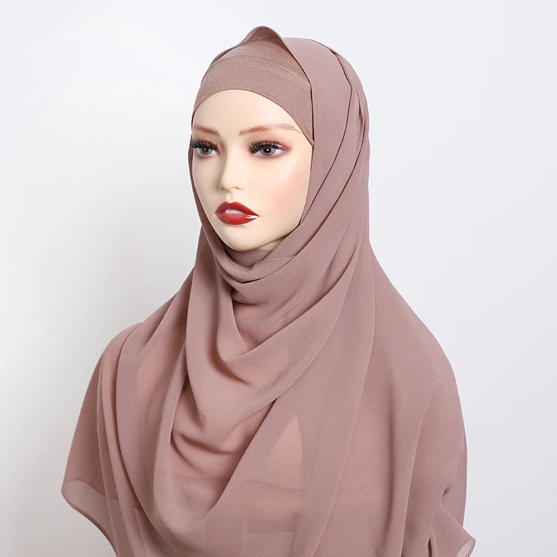 A model wearing a dusty rose chiffon matching inner scarf set with a neutral skin tone.
