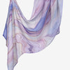 Elegant printed linen hijab scarf featuring soft purple and pink watercolor marble patterns