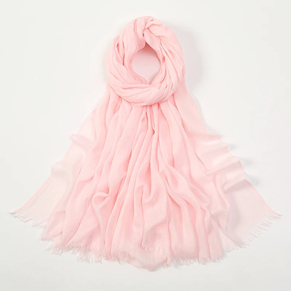 A soft pink elegant bamboo modal hijab scarf draped and flowing