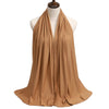 A beige premium modal jersey hijab draped around a mannequin's neck.