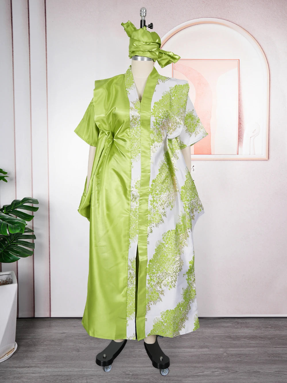A lime green kaftan dress for women featuring white tatting detail, displayed on a mannequin.