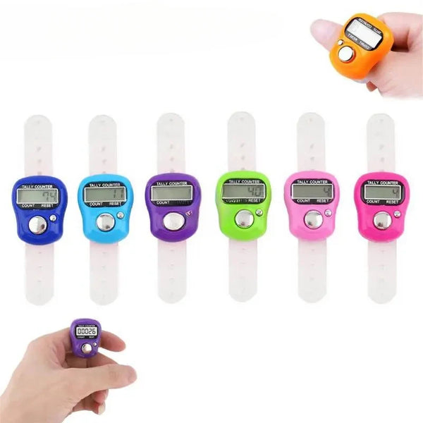 A set of mini digital finger counters in various colors, including yellow, blue, purple, and green, being held by a hand.