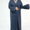 A dark blue elegant women's abaya trench coat worn by a model.