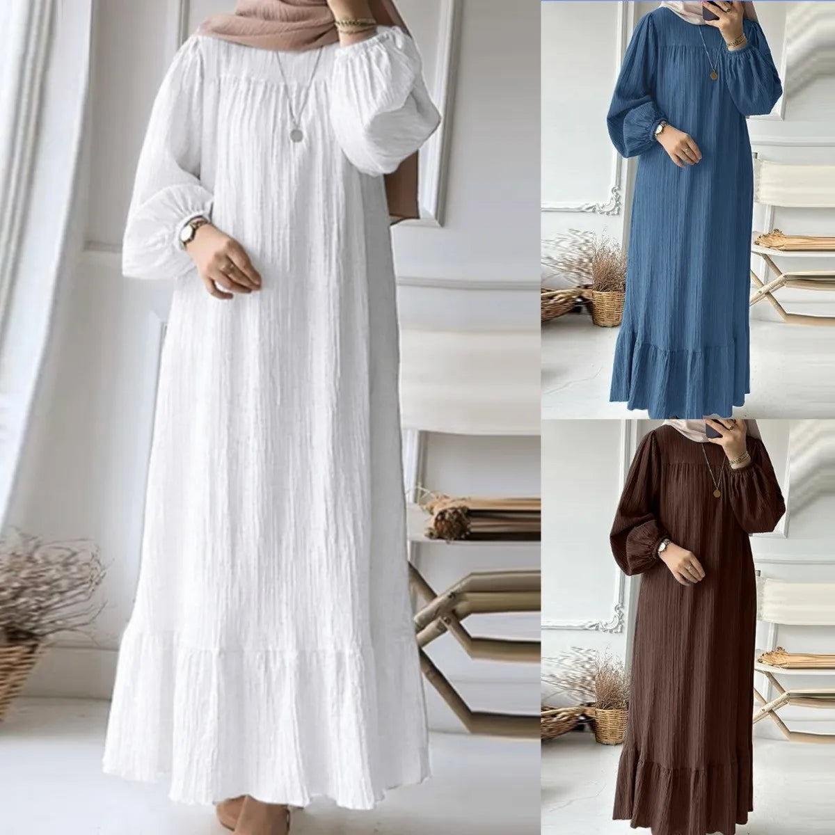 Robe maxi bohème blanche à manches froncées portée par un mannequin.
