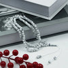 White 99 bead Islamic prayer tasbih for meditation and prayer with a red branch