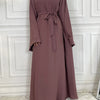 Elegane mauve maxi Abaya für Damen mit langen Ärmeln und zugebundenem Bund