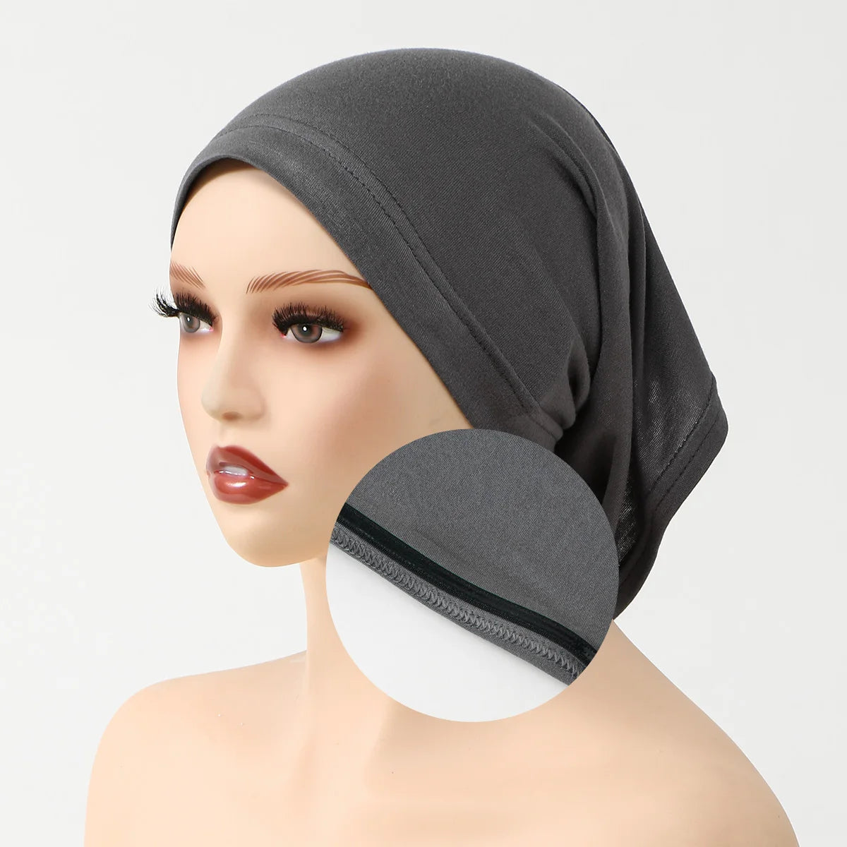 A model wearing a gray anti-slip inner hijab cap on her head.