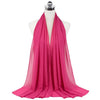 A vibrant pink chiffon hijab scarf draped around a mannequin's neck.