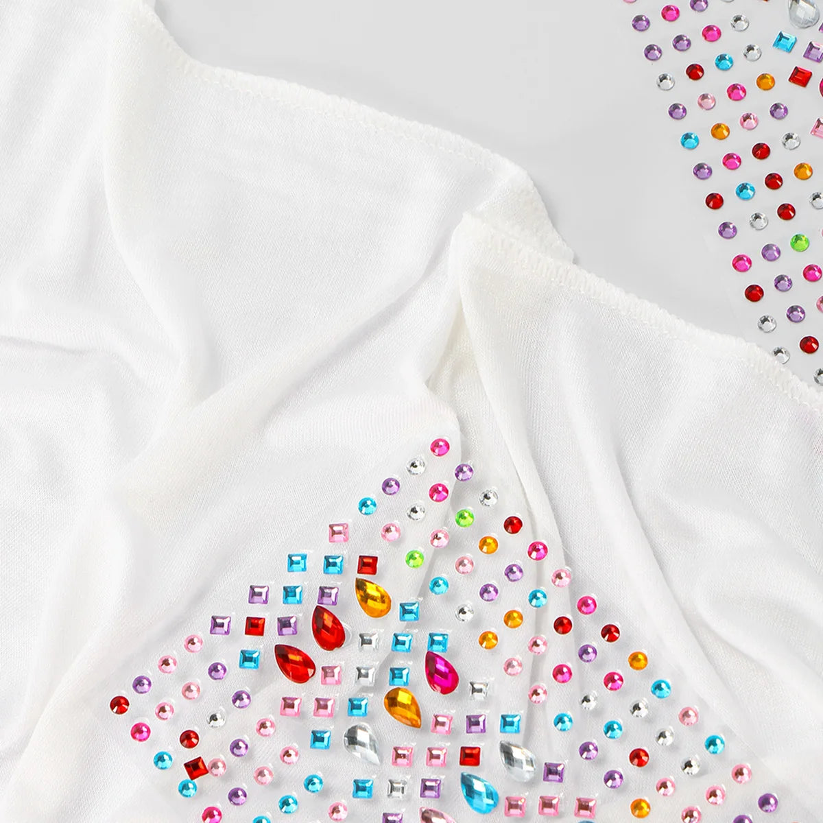 White soft modal jersey hijab scarf featuring colorful rhinestones along the edge