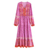 A long-sleeved, pink floral maxi dress with intricate embroidery and lantern sleeves.