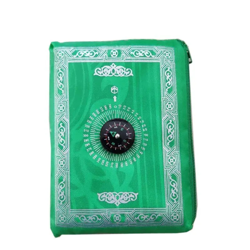 A green portable braided prayer rug featuring an ornate design and a compass rose.