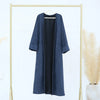 A navy blue elegant women's abaya trench coat hanging on a gold-toned hanger against a white background.