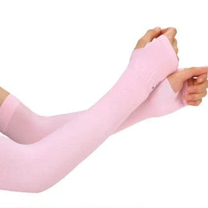 Light pink cooling UV protection arm sleeves being worn on an arm.