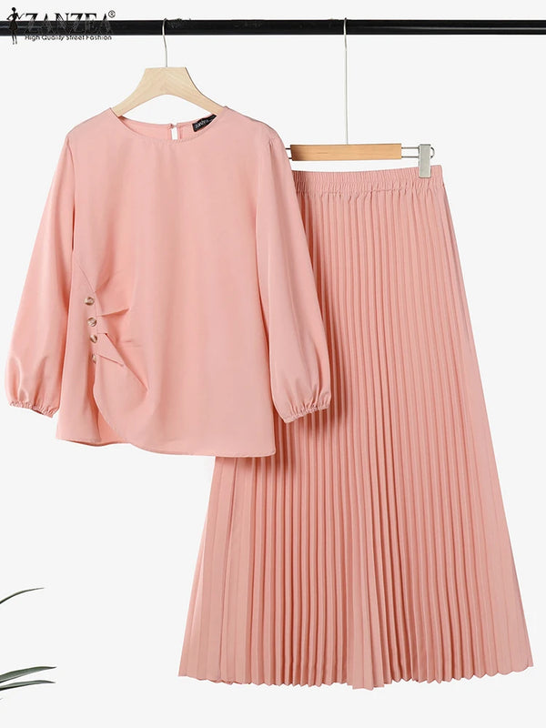 A pink long-sleeved top and matching pleated skirt set for a Muslim outfit.