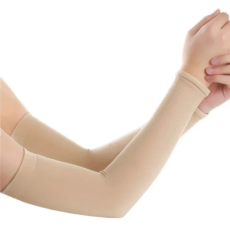A close-up of beige cooling UV protection arm sleeves being worn on an arm.