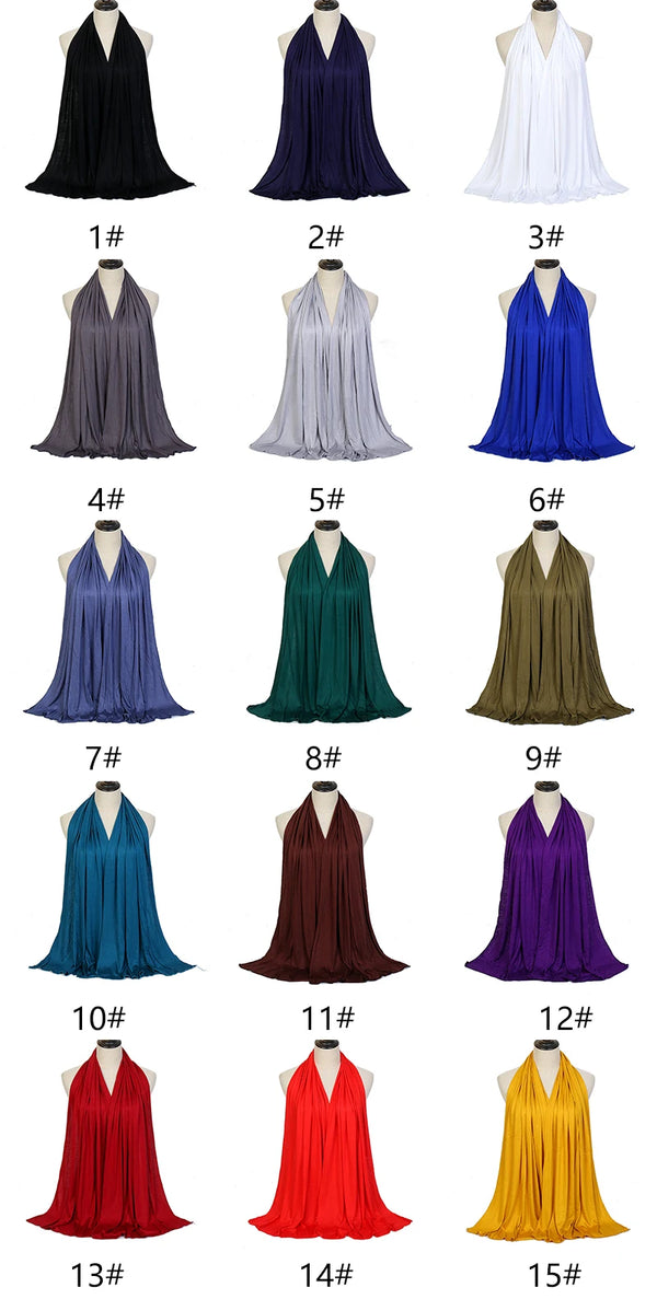 A collection of fifteen women's hijab scarves in various shades of blue, green, purple, and black.