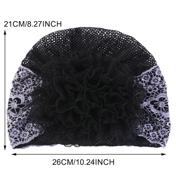 Black floral beaded turban hat shown flat view with dimensions 21cm by 26cm