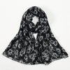 Schwarzer floraler Viskose-Hijab-Schal mit durchscheinendem Stoff und lockerem Fall.