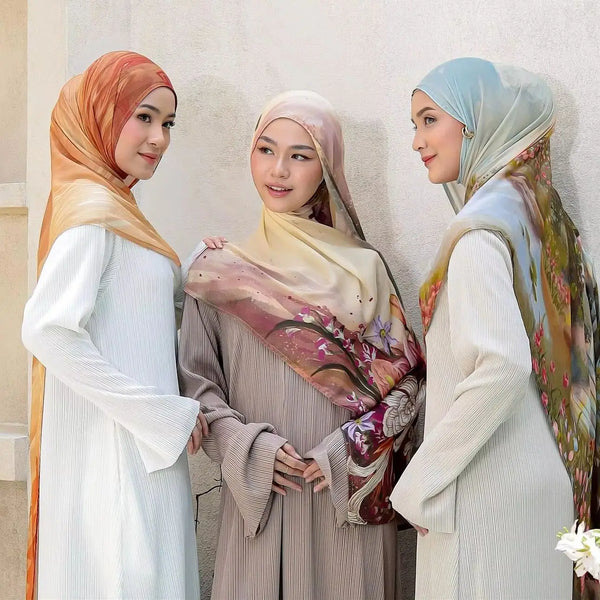 Three women wearing watercolor ombre printed rayon modal hijab scarves in neutral tones