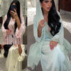 Una mujer modela un elegante vestido kaftan verde menta con bordado blanco en dos estilos diferentes.