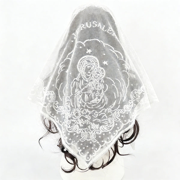 A sheer white embroidered triangle shawl featuring the image of the Madonna and Child with a halo.