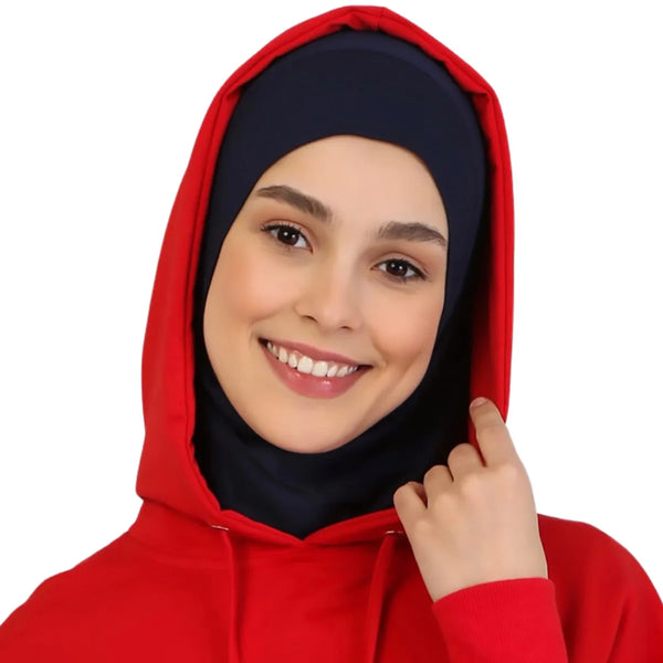 A woman wearing a red instant ready-to-wear hijab with a hood.