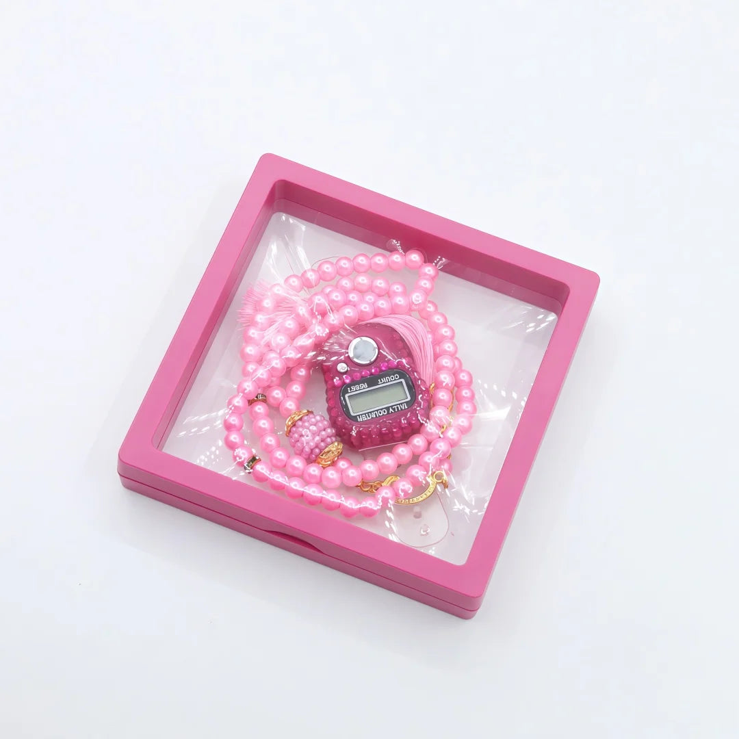 Pink prayer beads with a digital counter bracelet displayed in a pink box.