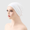 A white adjustable elastic headband hijab cap worn on a mannequin head.