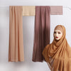 A set of three matching chiffon inner scarves in shades of beige, mauve, and brown displayed on a hanger.