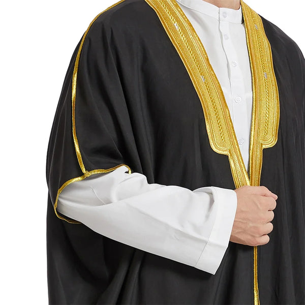 Black men's jubba kaftan with gold trim and white shirt displayed on a male model.