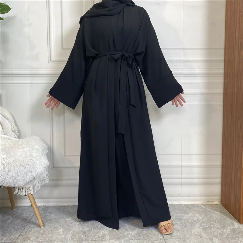 A black elegant women's abaya and kaftan set displayed on a mannequin.