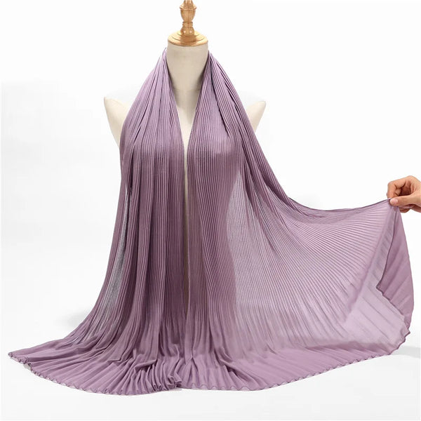 A lilac crinkle chiffon hijab scarf draped around a mannequin's neck and shoulders.