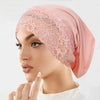 Model wearing a pink lace knit inner hijab undercap turban bonnet