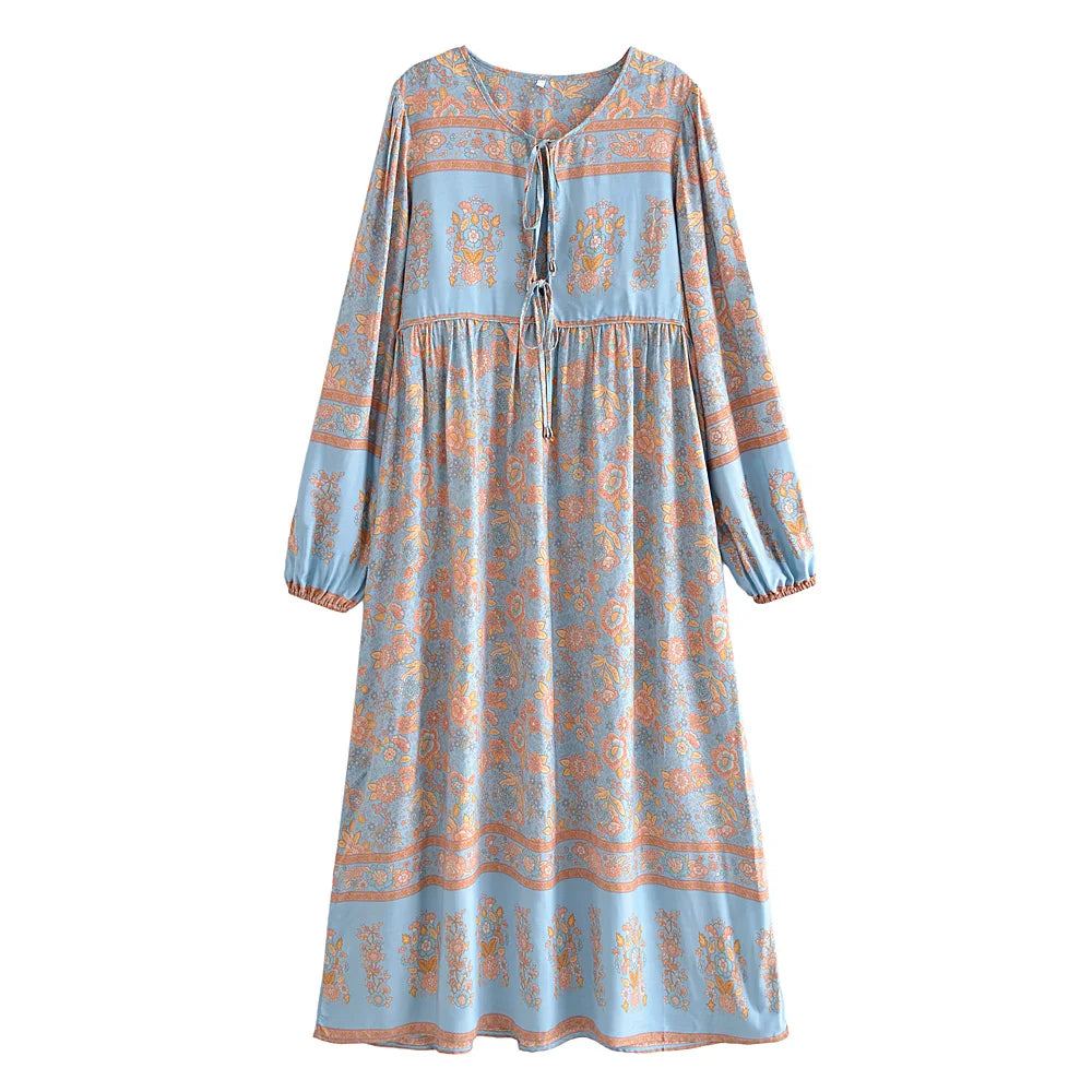 A light blue bohemian floral maxi dress with lantern sleeves and a button front.